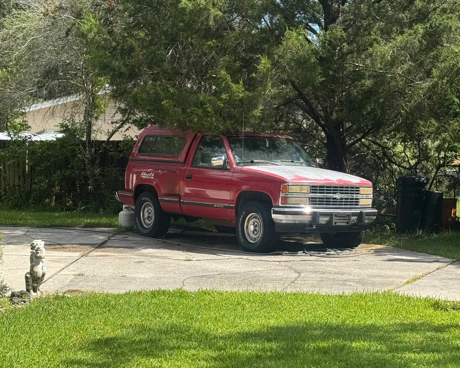 1992 Chevrolet 1500 step-side 4x4 with a camper shell bought for cash from a Florida driveway