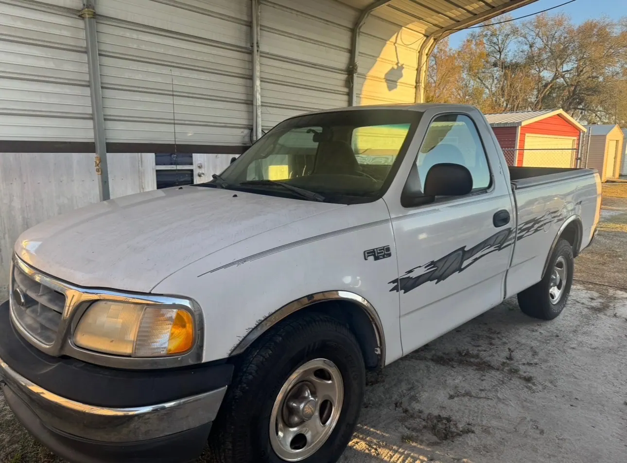 2001 Ford F-150 XL regular cab work truck bought for cash under a carport in Florida